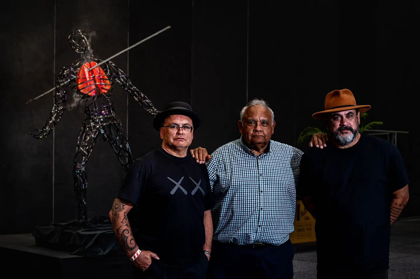 Image (L to R): Shane Kawenata Bradbrook, Tom Calma, and Shannon Best at the Oceania Tobacco Control Conference. Background: The Kilung Morunbul Jum (Death by Smoke) statue. By Claudine Thornton Creative.